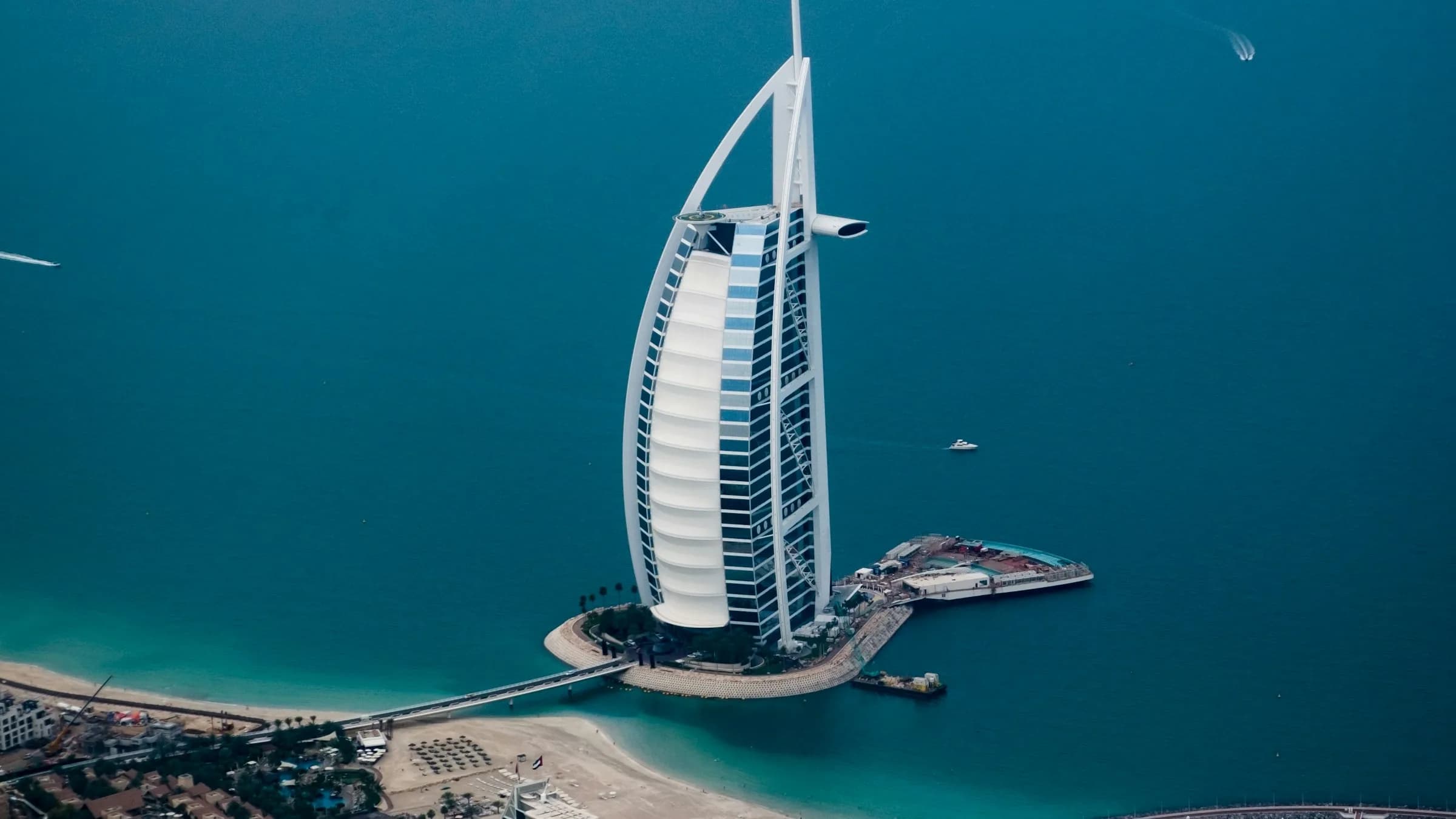 Burj Al Arab and Dubai waterfront at dusk — UAE Golden Visa destination