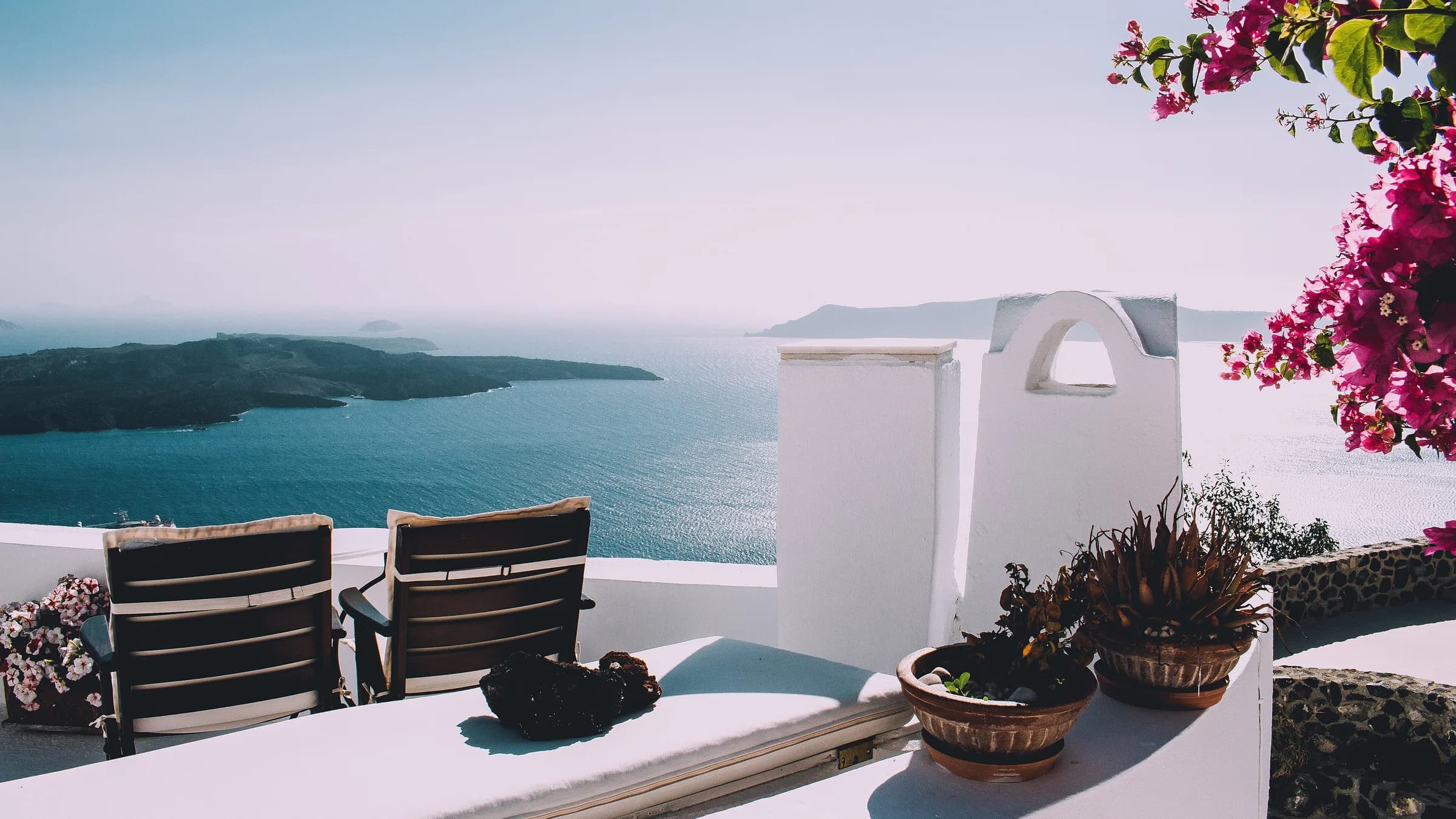 Aegean hillside architecture — Golden Visa residence versus a second passport