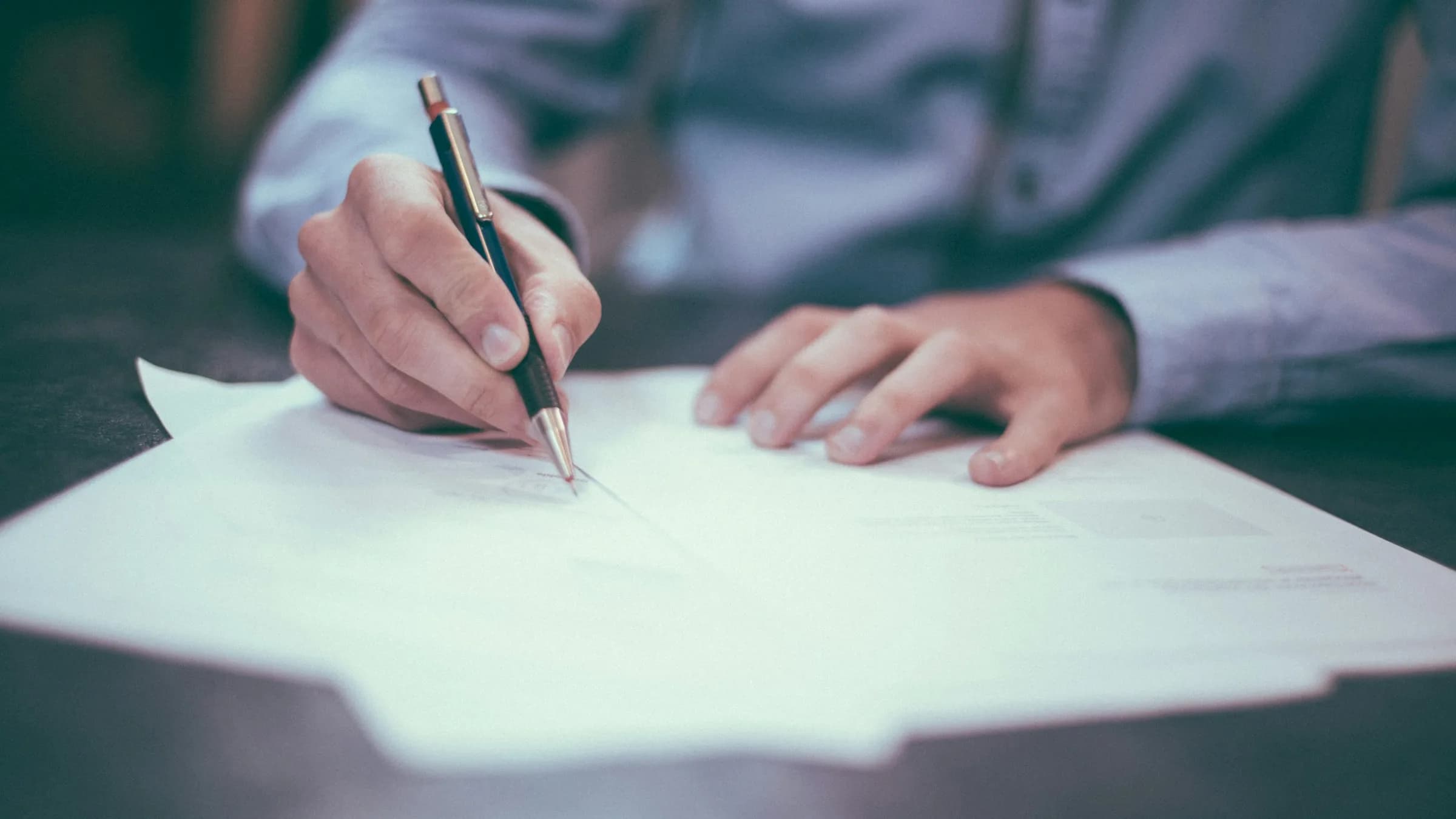 Primary-source documents and notes on a desk — how pass2port traces figures