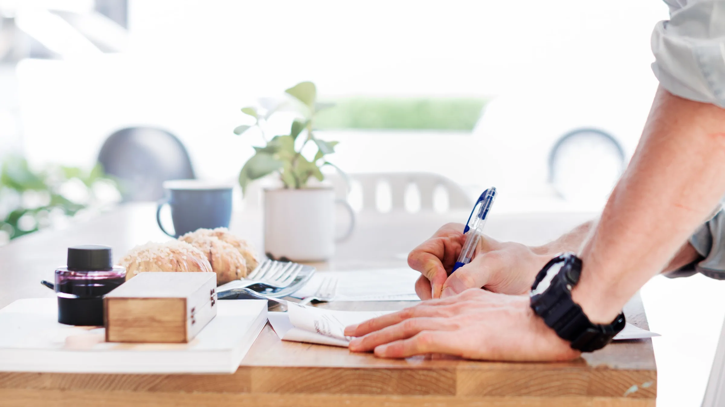 Writing at a standing desk — citizenship is not tax residence